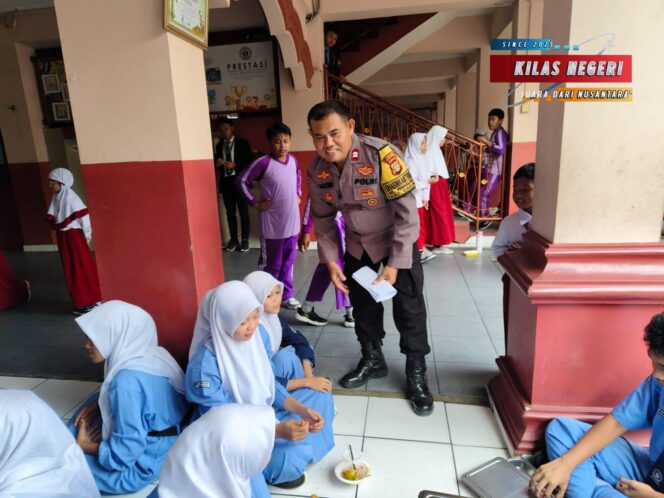 Bhabinkamtibmas Kawal Pembagian Makanan Bergizi Gratis di Penggilingan: Wujud Nyata Kepedulian Negara